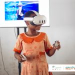 Young Ghanaian girl using Meta Glasses